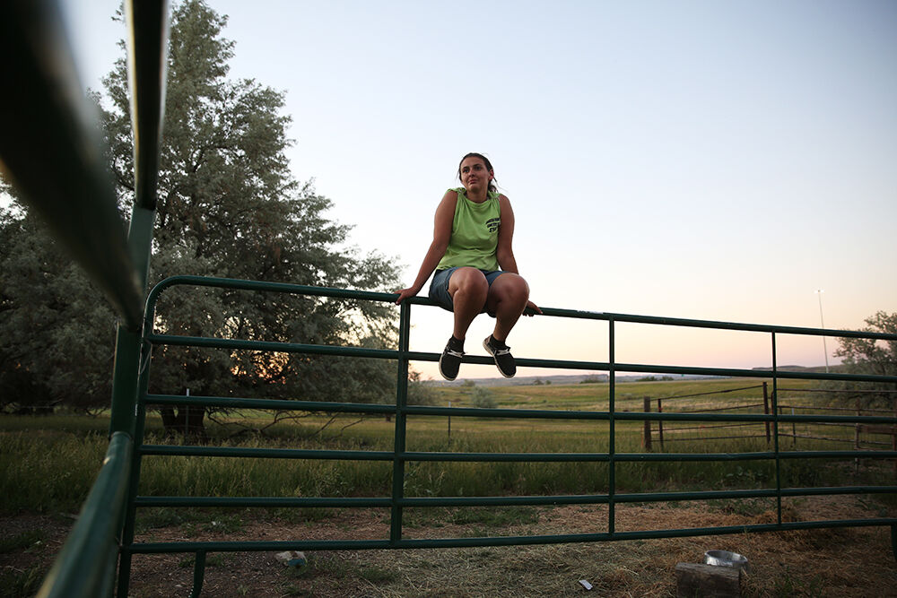 Laurel Rozema relaxes from the top of a panel
